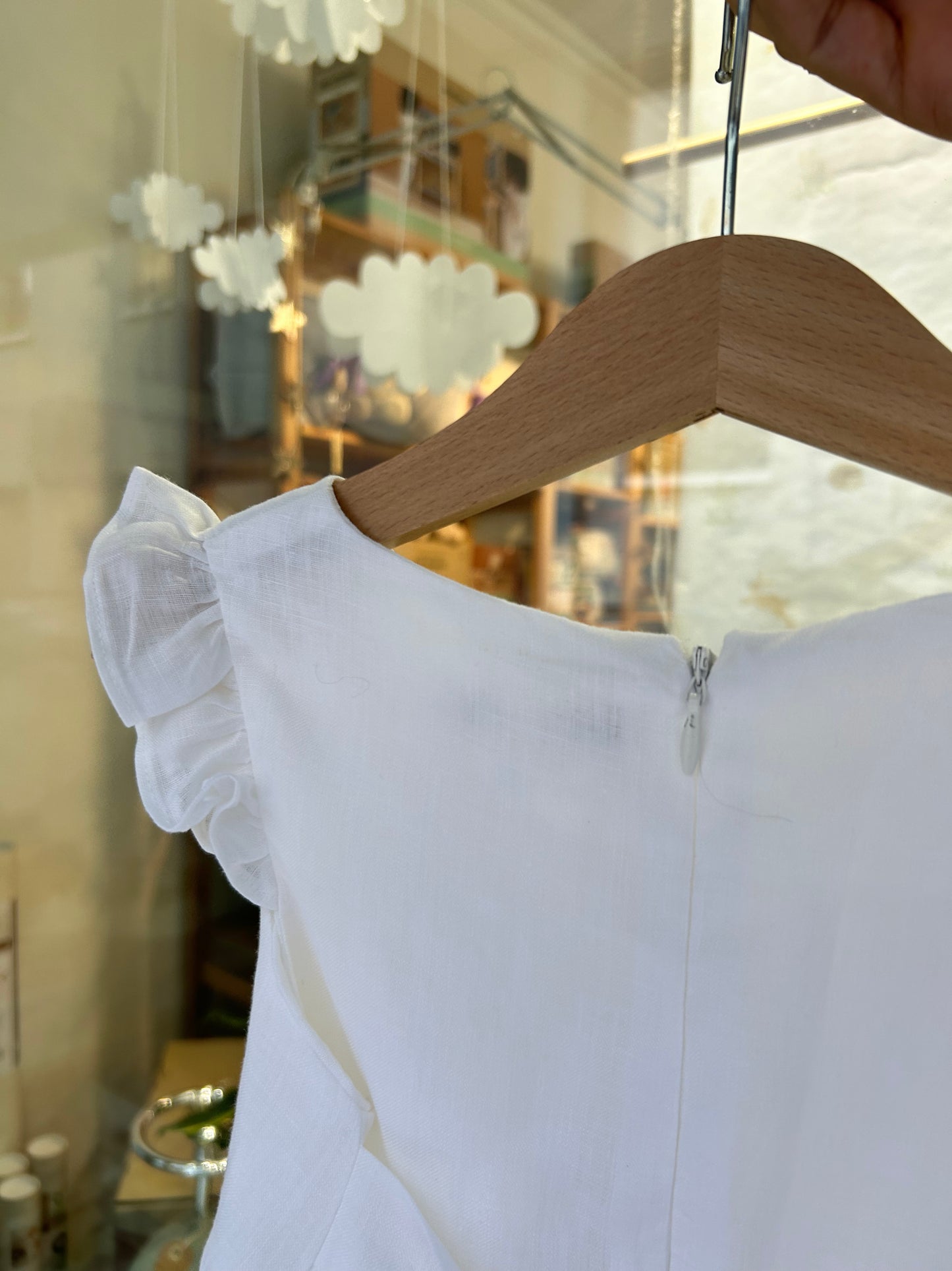 Elegant white linen dress with bow on the back