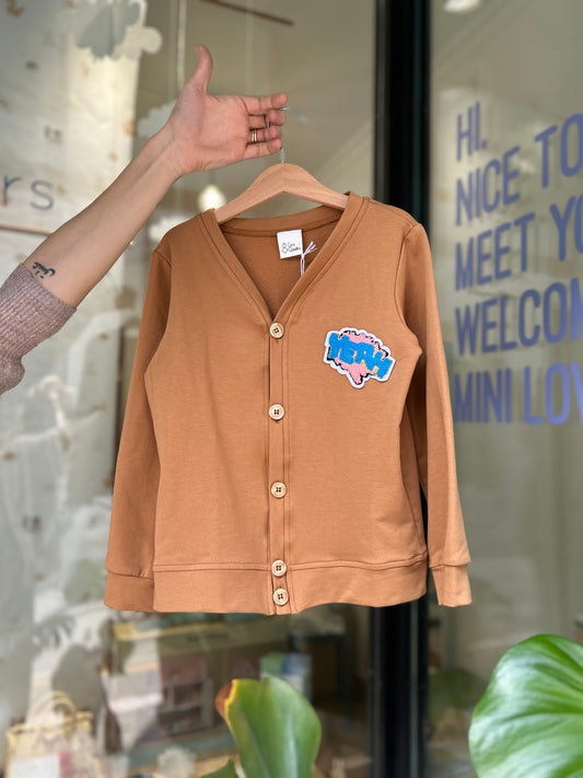 Caramel cardigan with "YEAH" patch