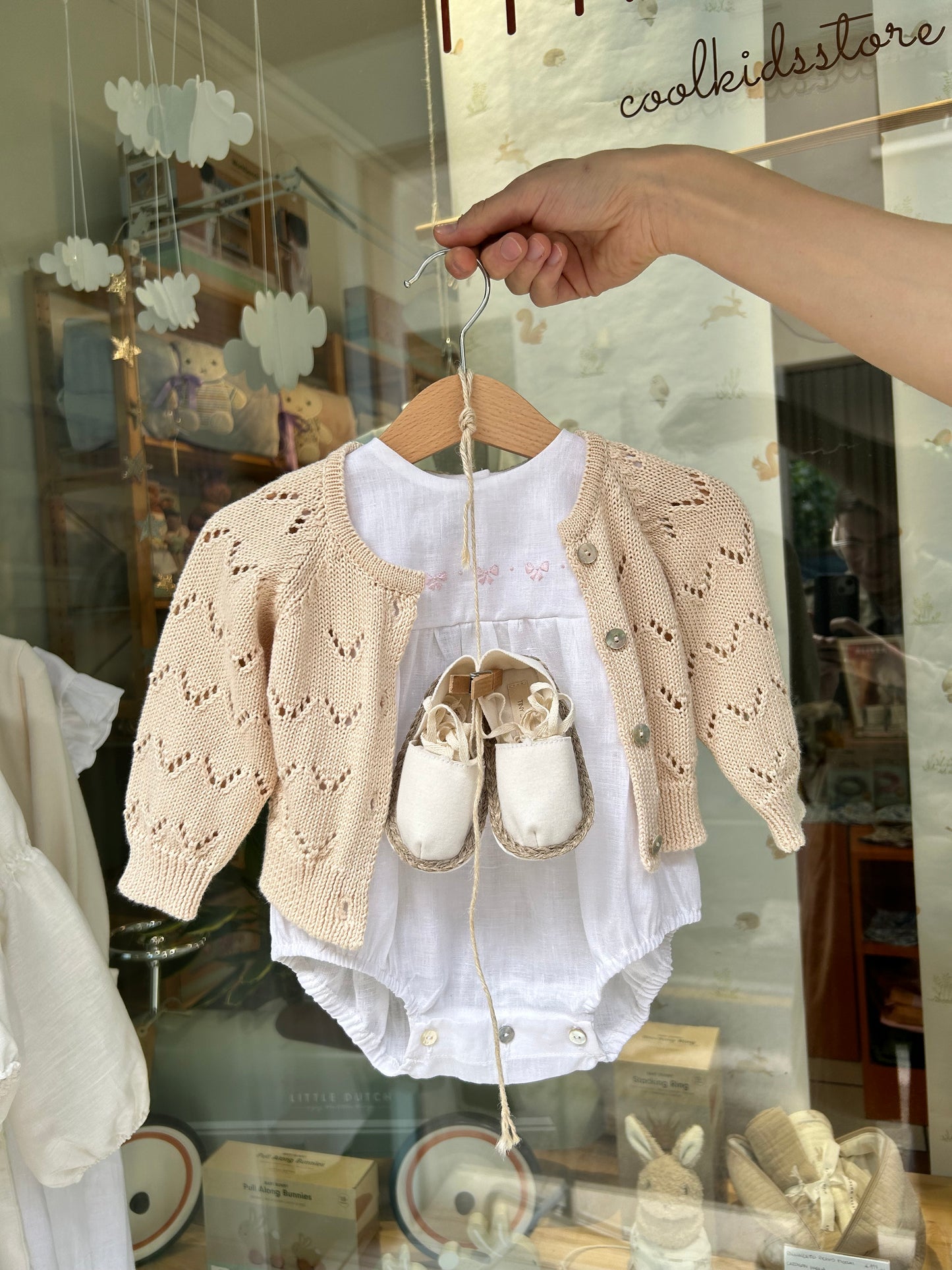 Linen romper with pink bow embroidery