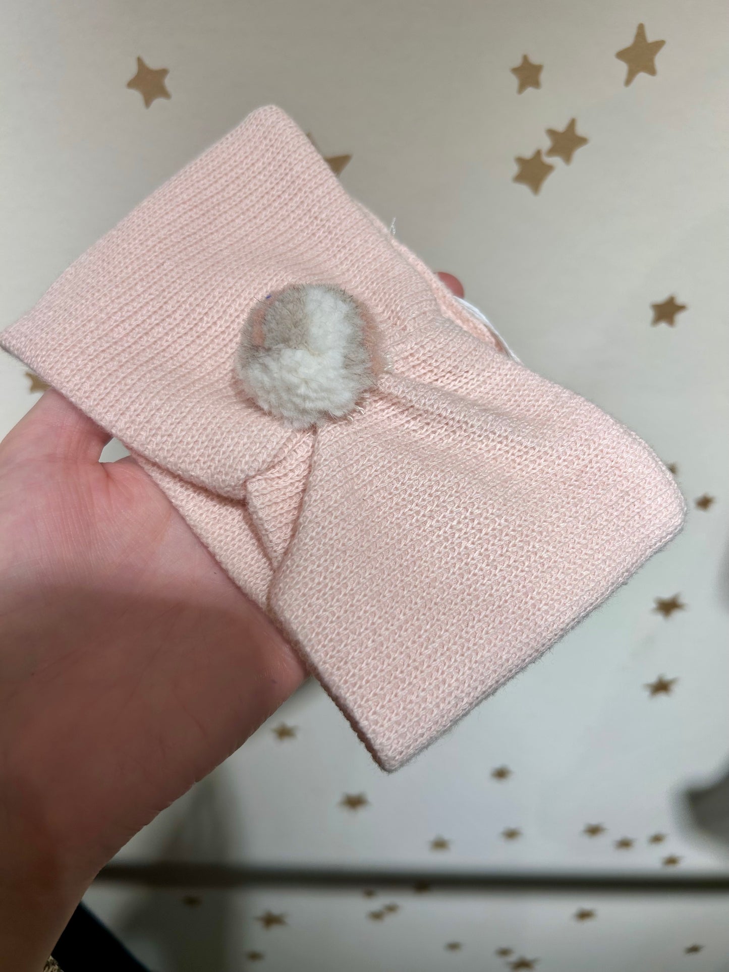 Fascia in maglia rosa pon pon